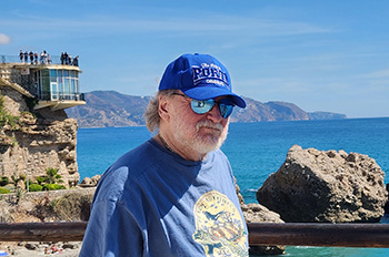 Barry Feig enjoying rocky coastline view in Portugal